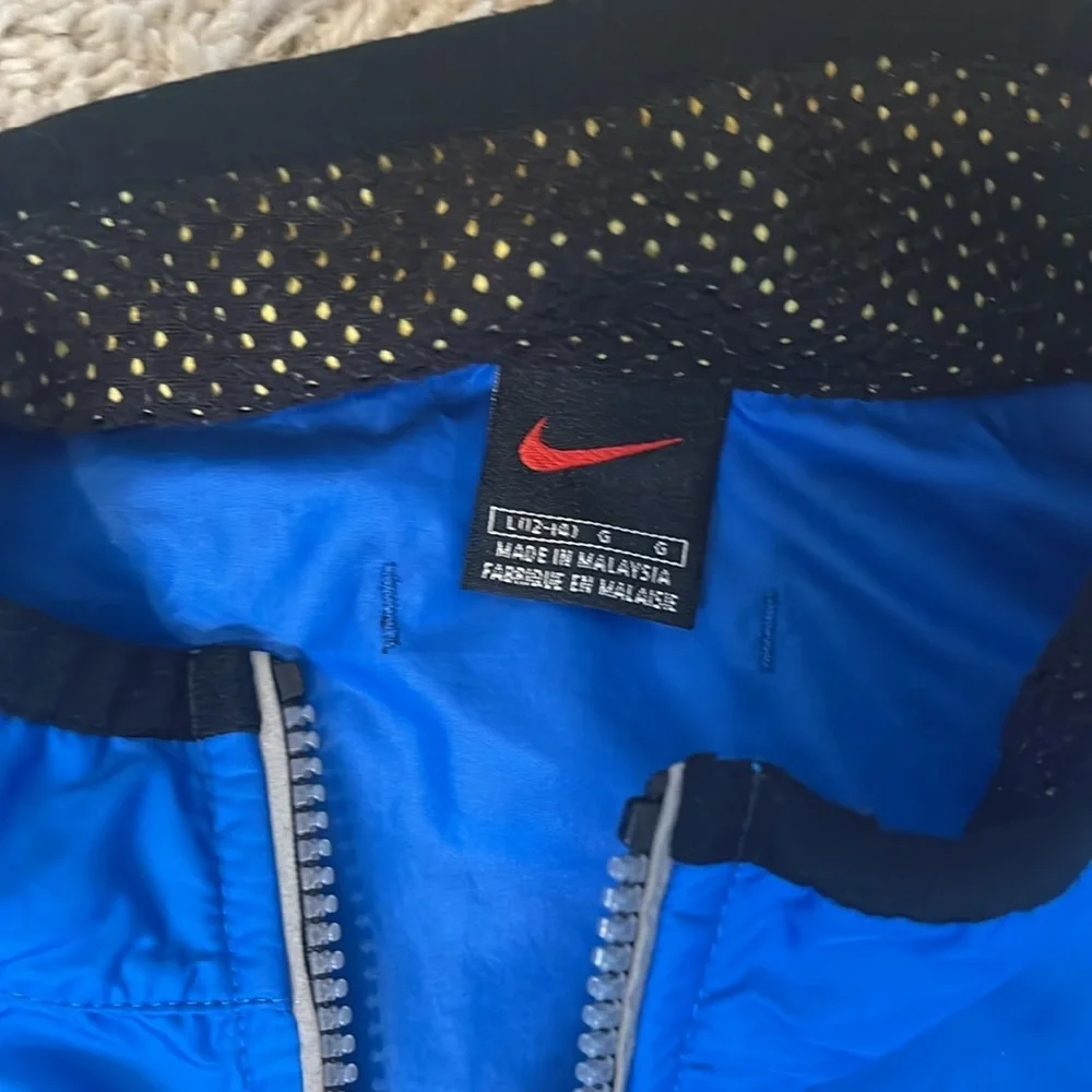 Nike youth L royal blue grey 1/2 zip windbreaker. Loose fit. Great condition